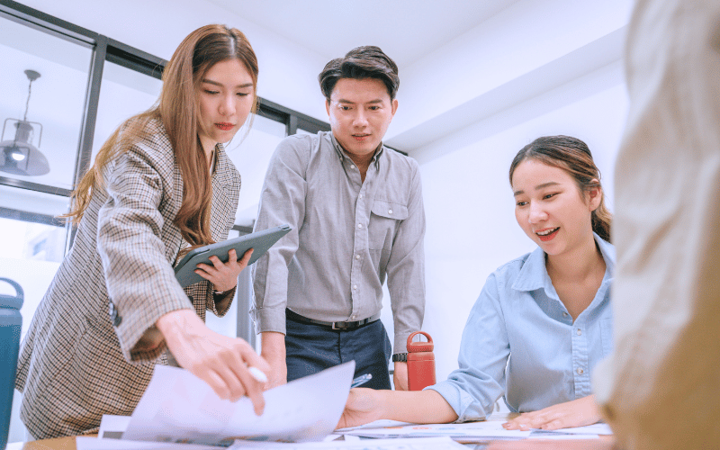 A diverse group of students collaborating on a design project, reflecting teamwork in built environment and heritage studies