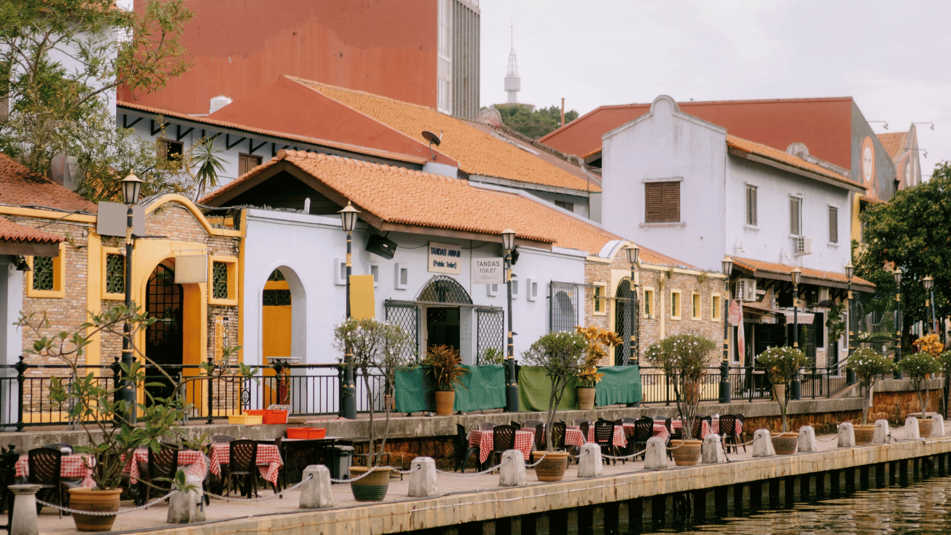 A heritage street scene featuring restored colonial-style buildings, representing the adaptive reuse of cultural architecture