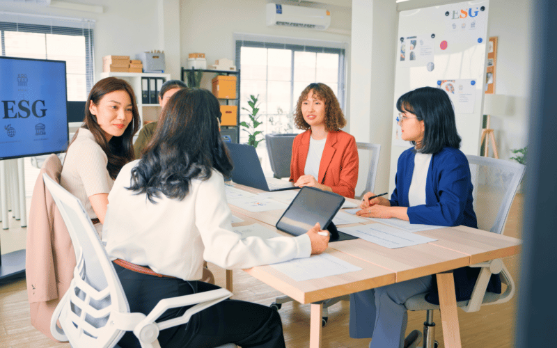 female co-workers having meeting relating to esg