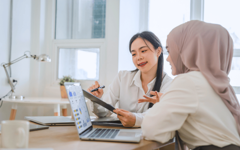 Two ladies discuss about data 