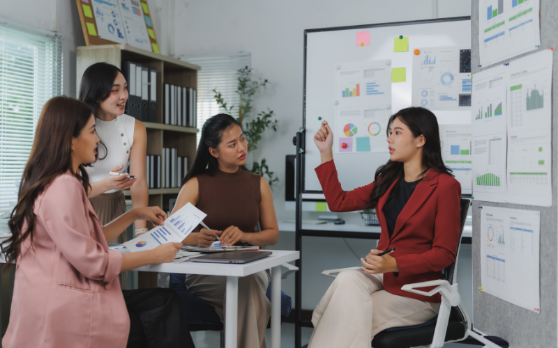 Woman talking to a group of people