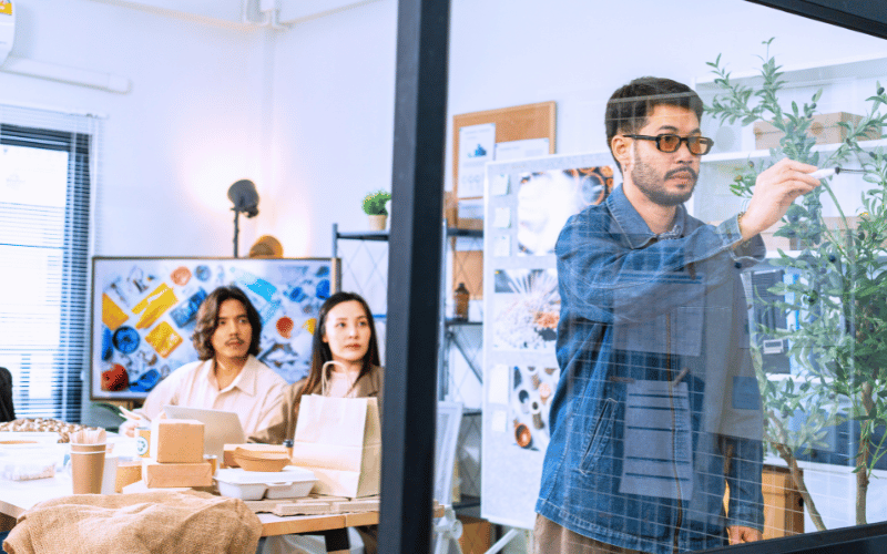 Creative team with mood boards and cardboard models planning for events