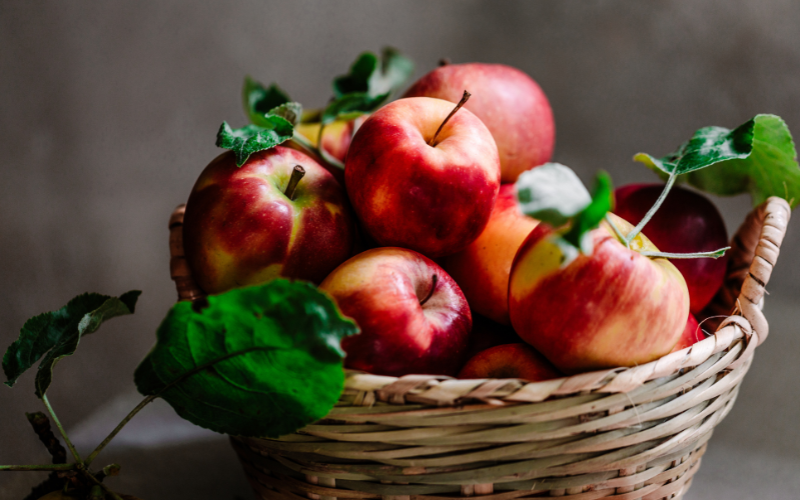 A wicker basket of apples