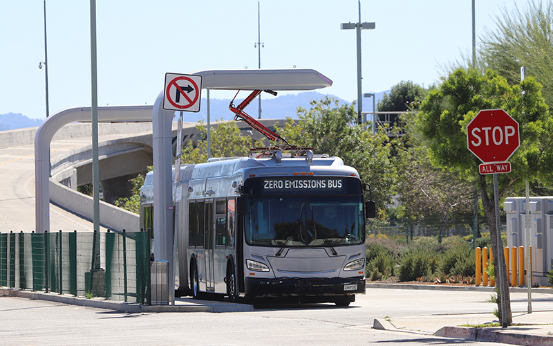 Bus running clean energy charging at station