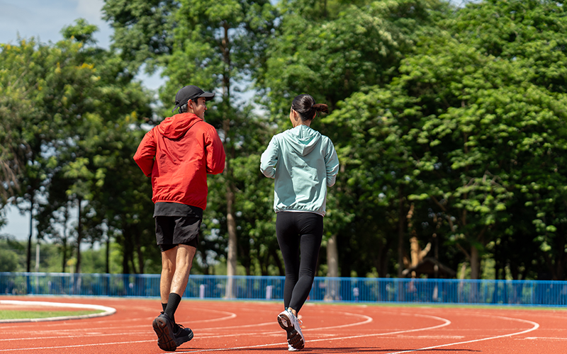 Couple running on the track