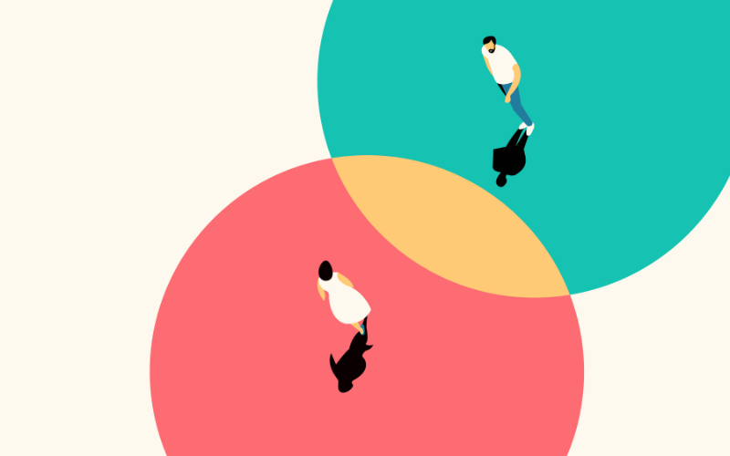 Two people walking in different circles overlap with each other as symbol of consensus of opinions