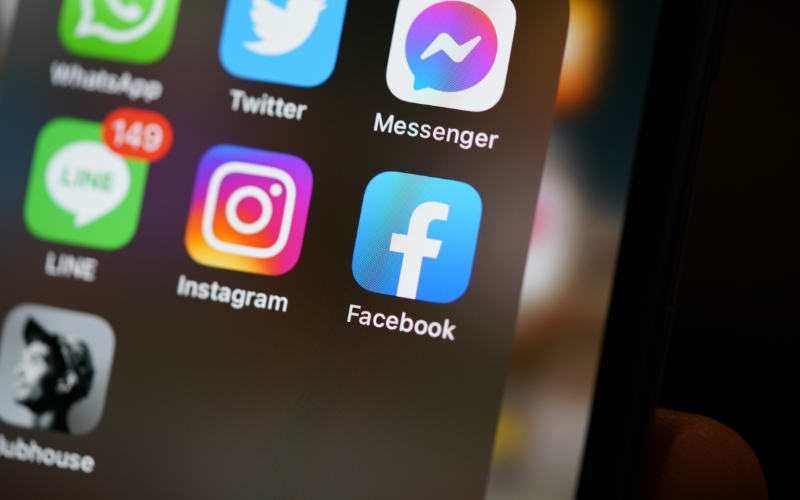 Close-up of a smartphone screen displaying social media apps