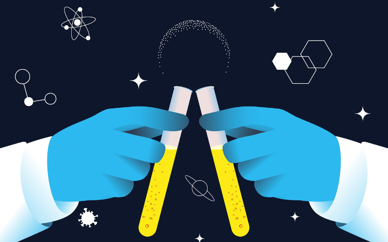 Gloved hands holding two test tubes with yellow liquid