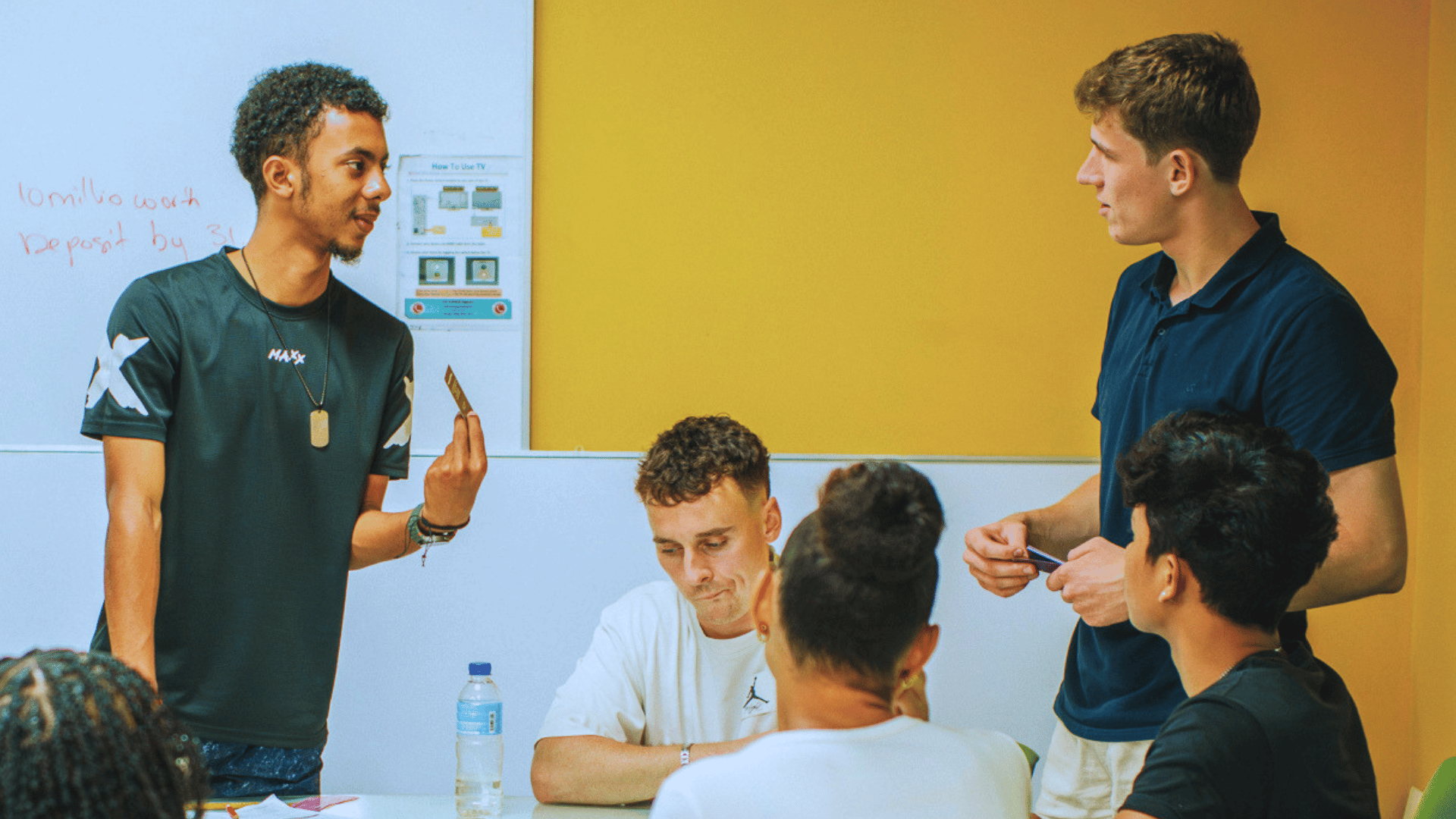 International student doing mock presentation with group