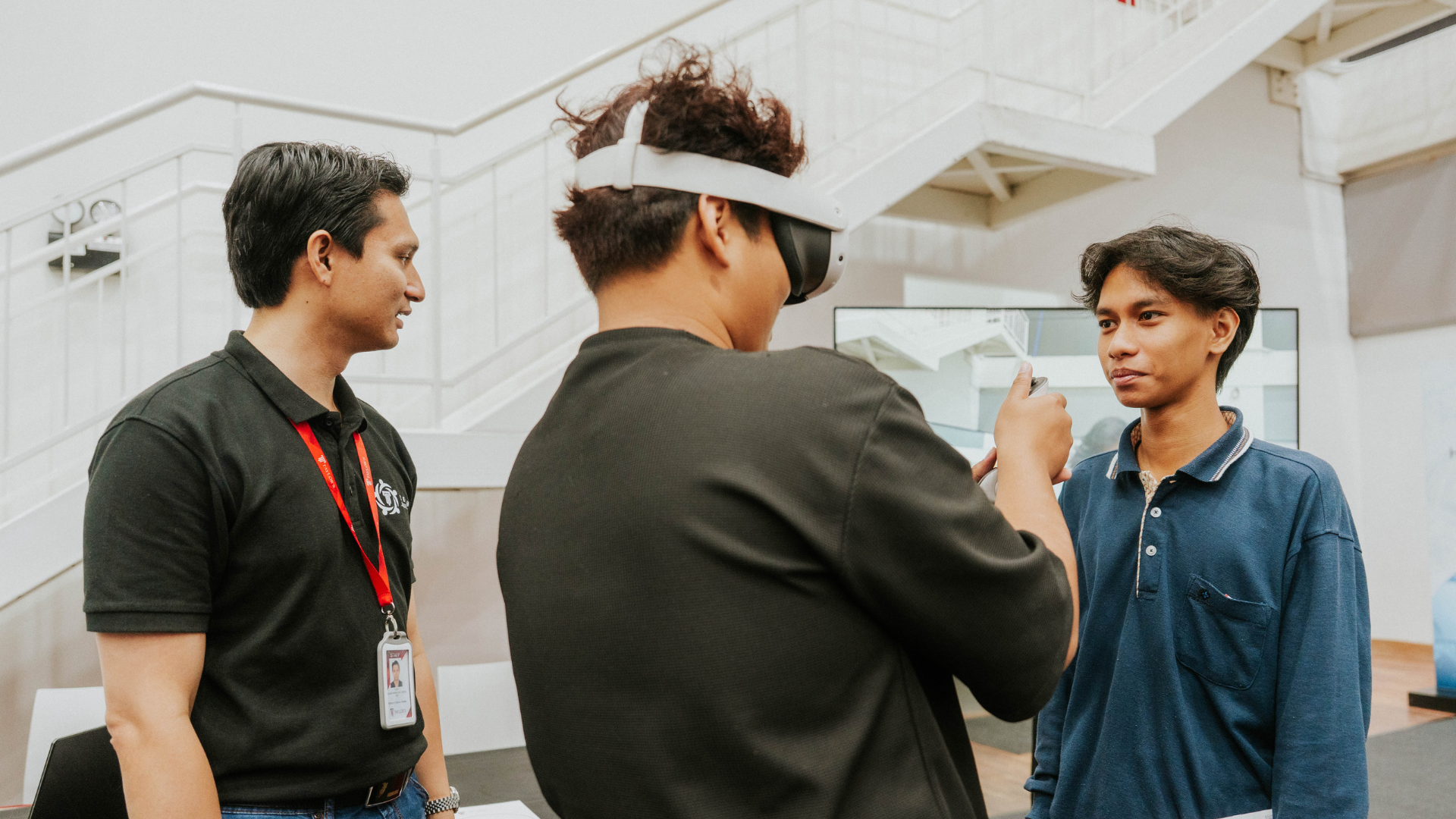 A prospective student using a virtual reality (VR) headset at Taylor's Open Day
