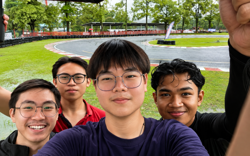 Jayden and friends taking a selfie at a go-karting track