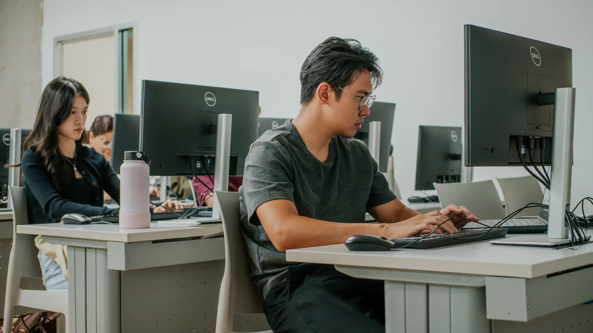 Taylor's Diploma in Accounting student typing away in aclassroom