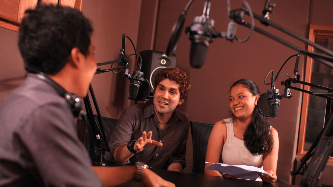 Students getting advice from broadcast expert