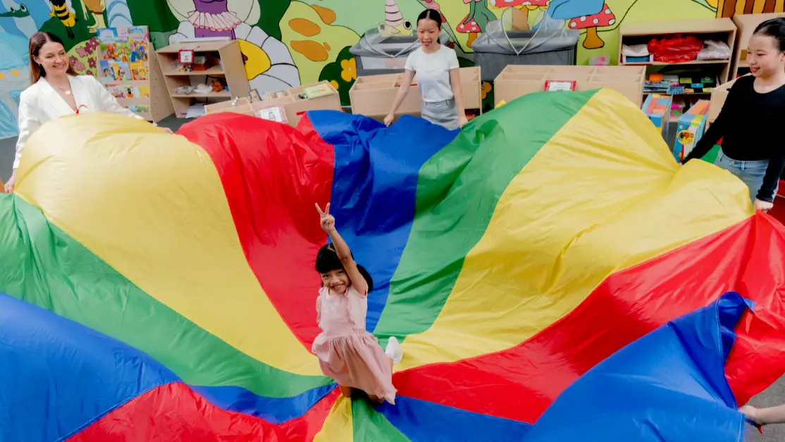 Teacher plays with pre-school children