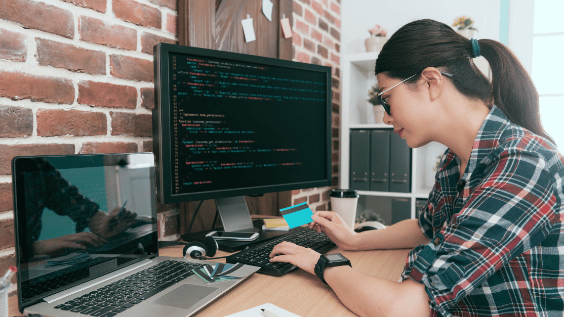Female lady coding at her work desk