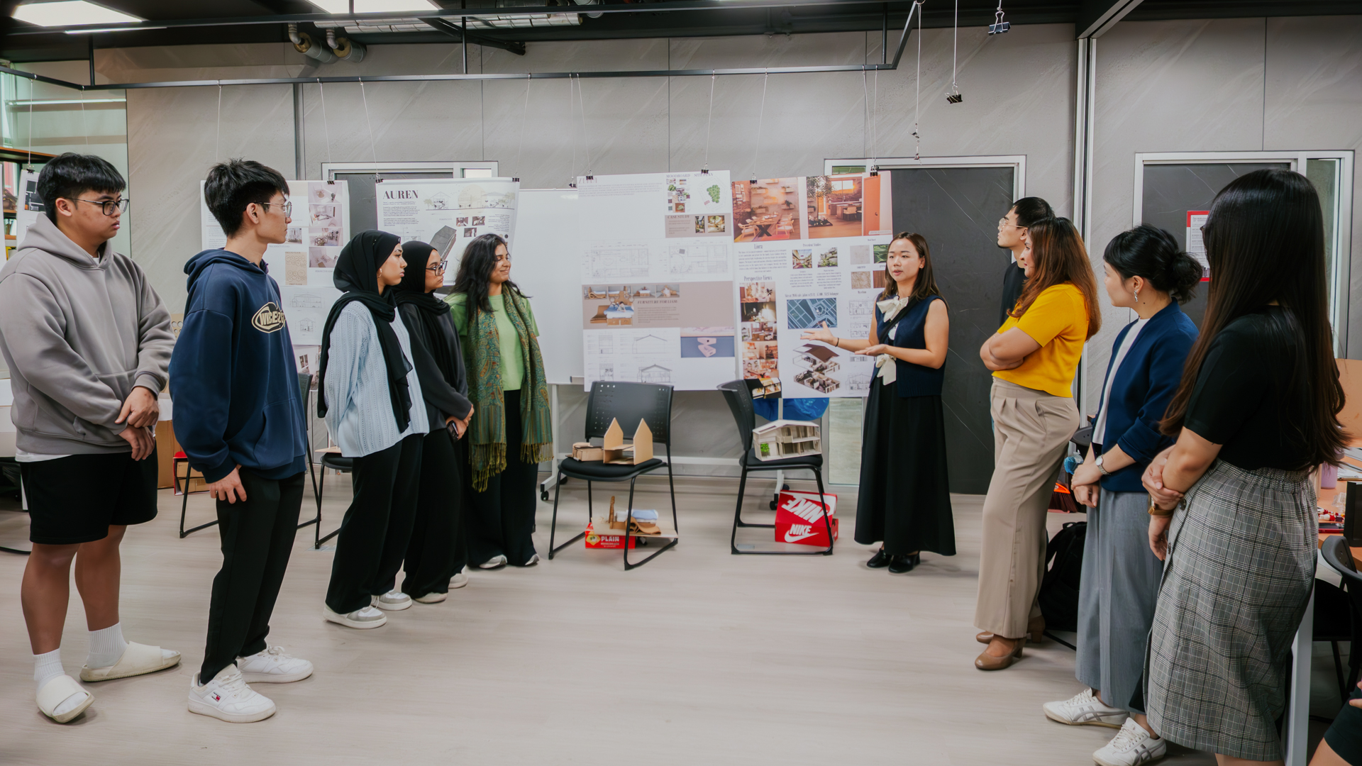Lecturer demonstrates lesson to students of Diploma in Interior Design