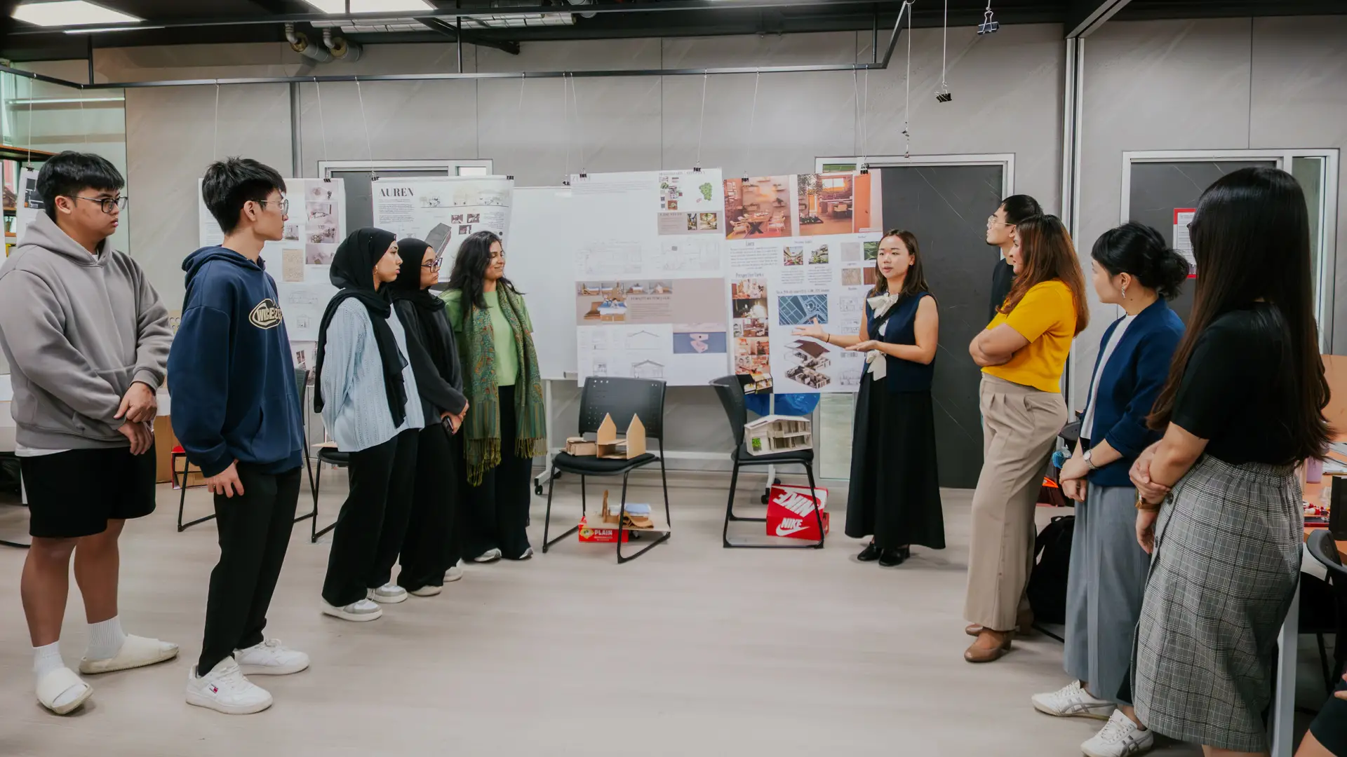 Lecturer demonstrates lesson to students of Diploma in Interior Design