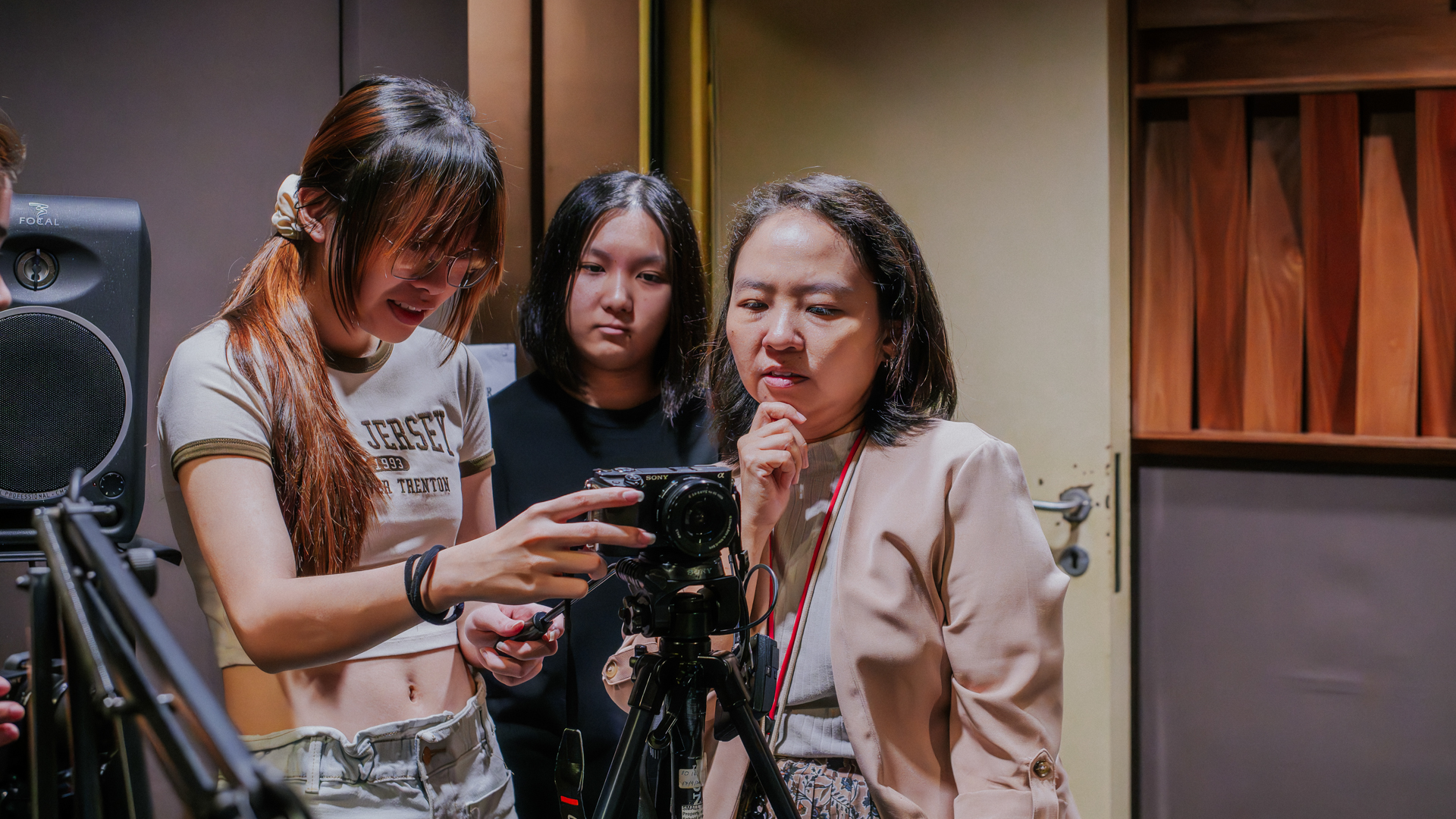 Arts Foundation student learns how to do use broadcasting camera.