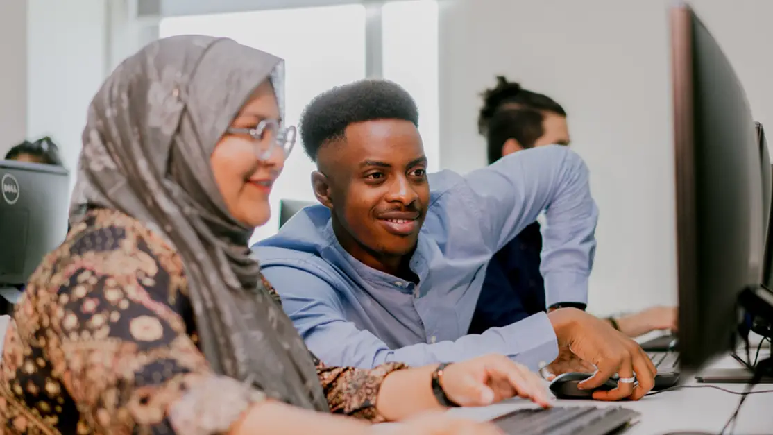Lecturer demonstrates learning material to student