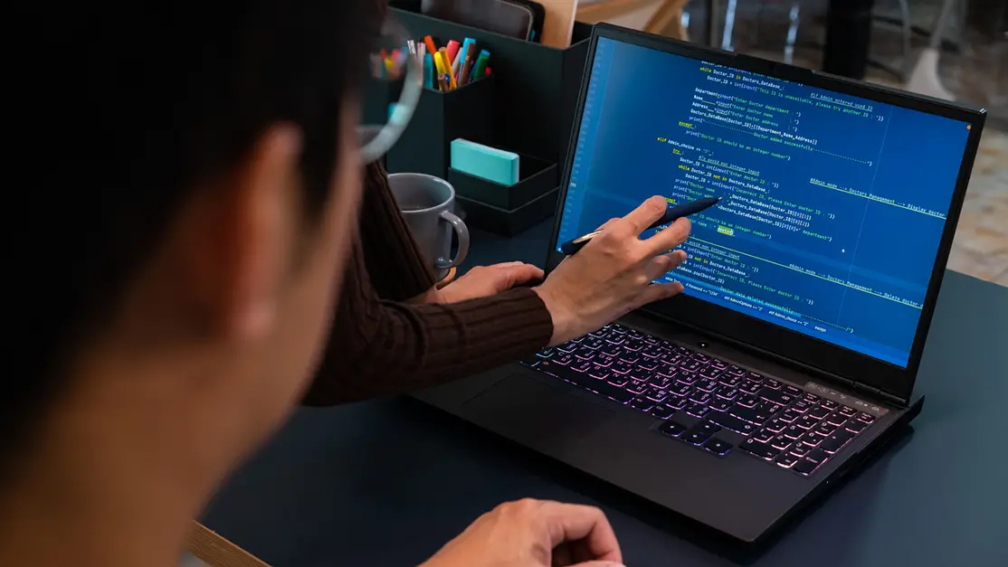 Student learning about coding on the laptop