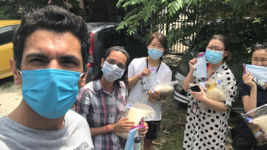postgraduate students doing community work during covid