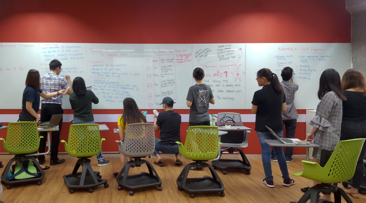 Students engaging in collaborative brainstorming session