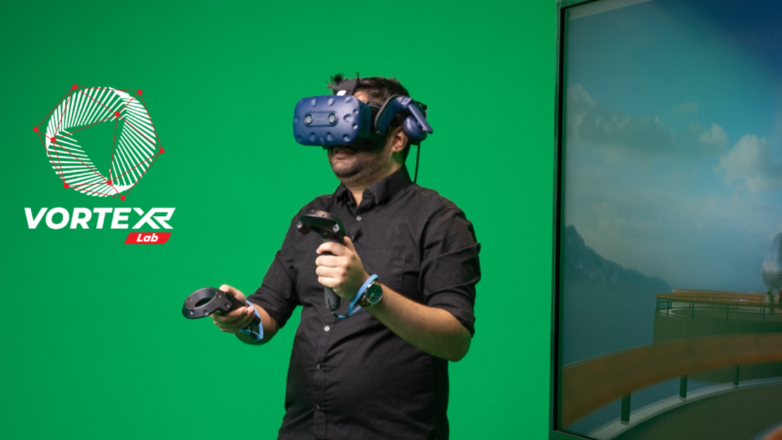 Taylor's student trying VR in the Vortex Lab