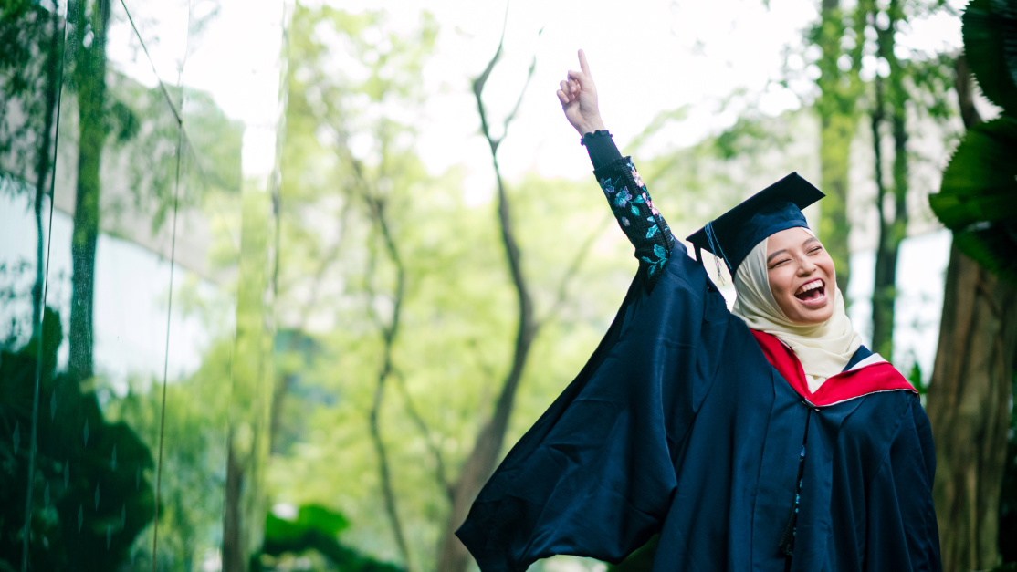 a muslim student graduating with a gown and hat