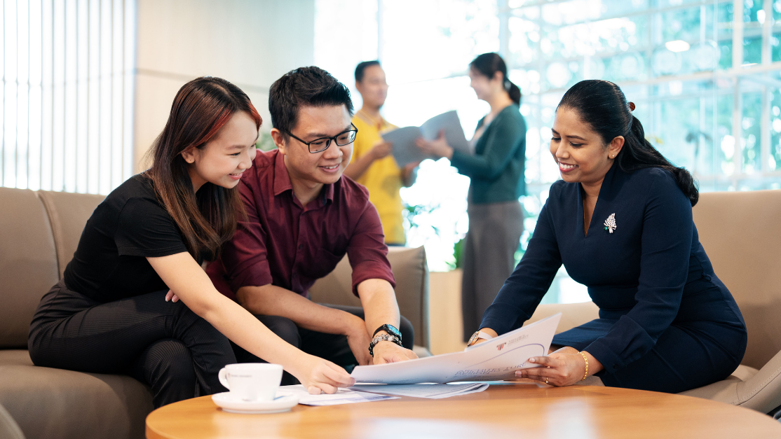 two students getting counselling by a counsellor