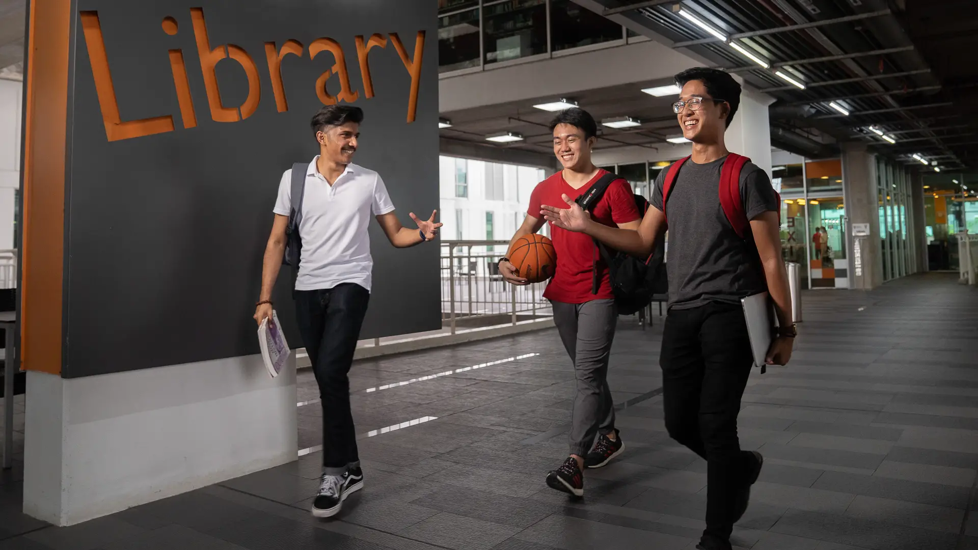 Taylor's students walking along a corridor