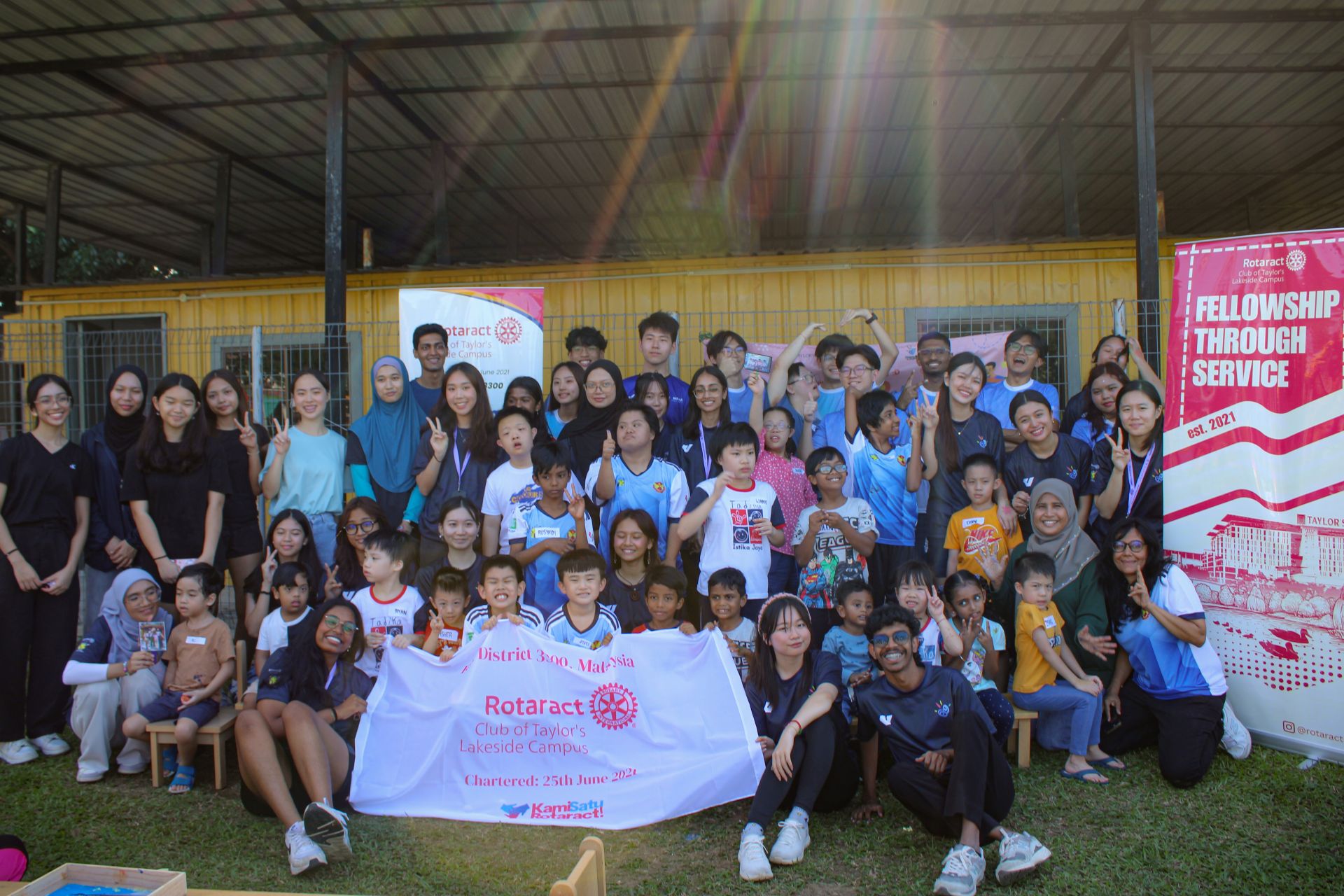 rotaract club posing at the beach