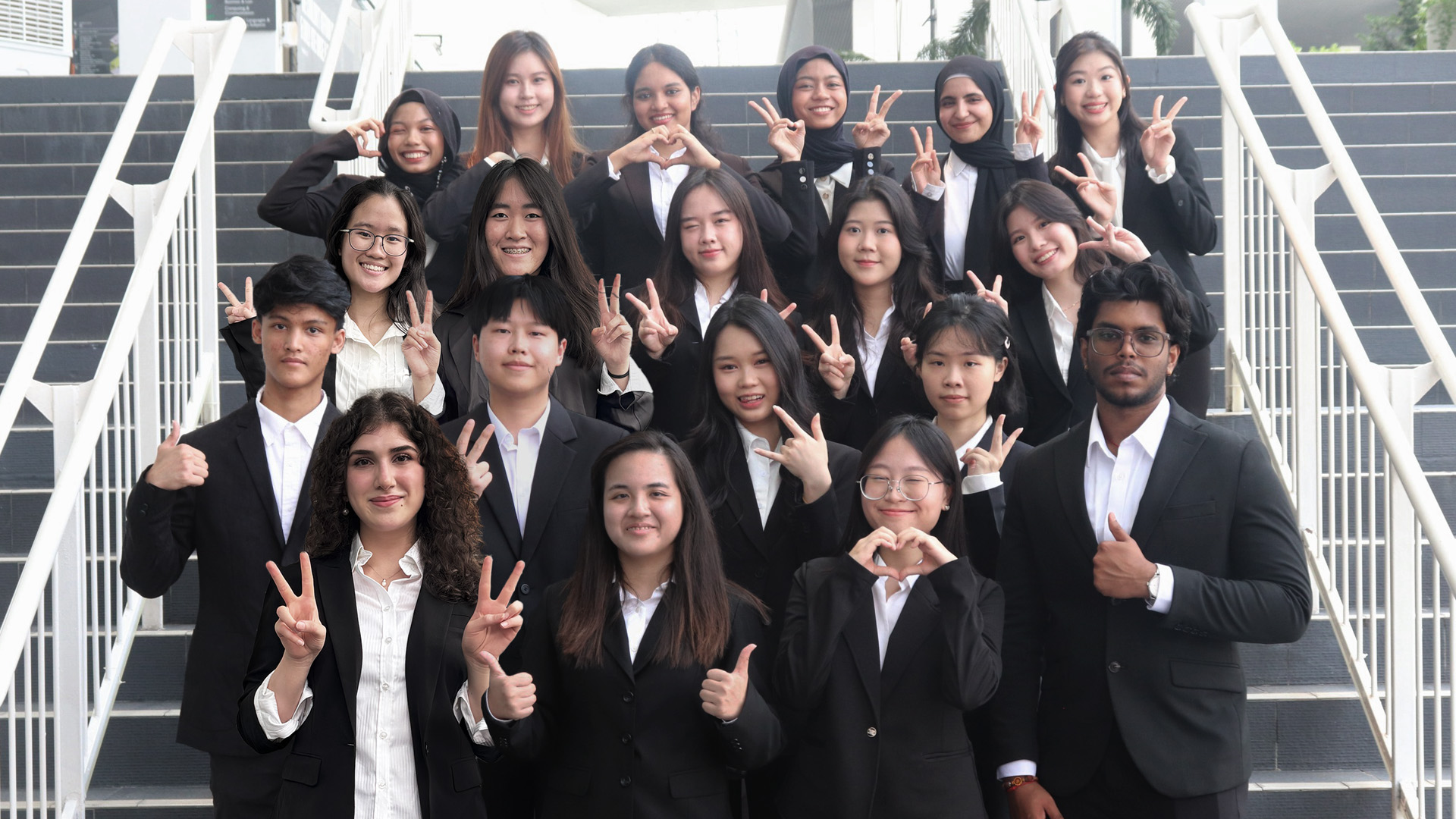 shine ambassadors posing for group picture on the stairs