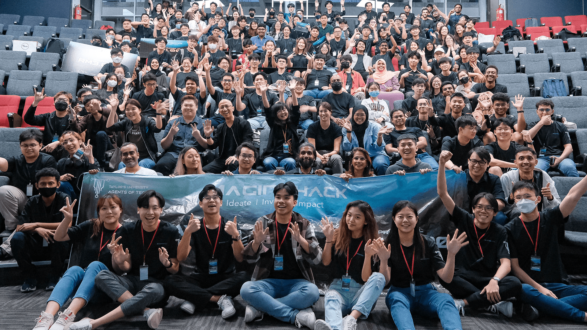 a group of tech students posing with hands crossed