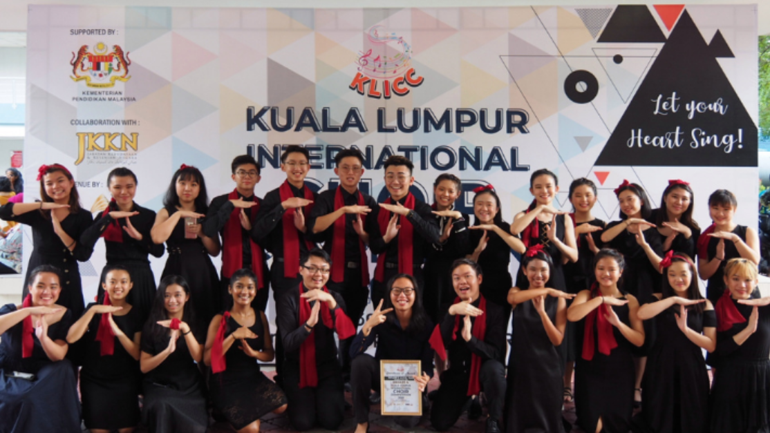 taylors live club choir members picture after a performance