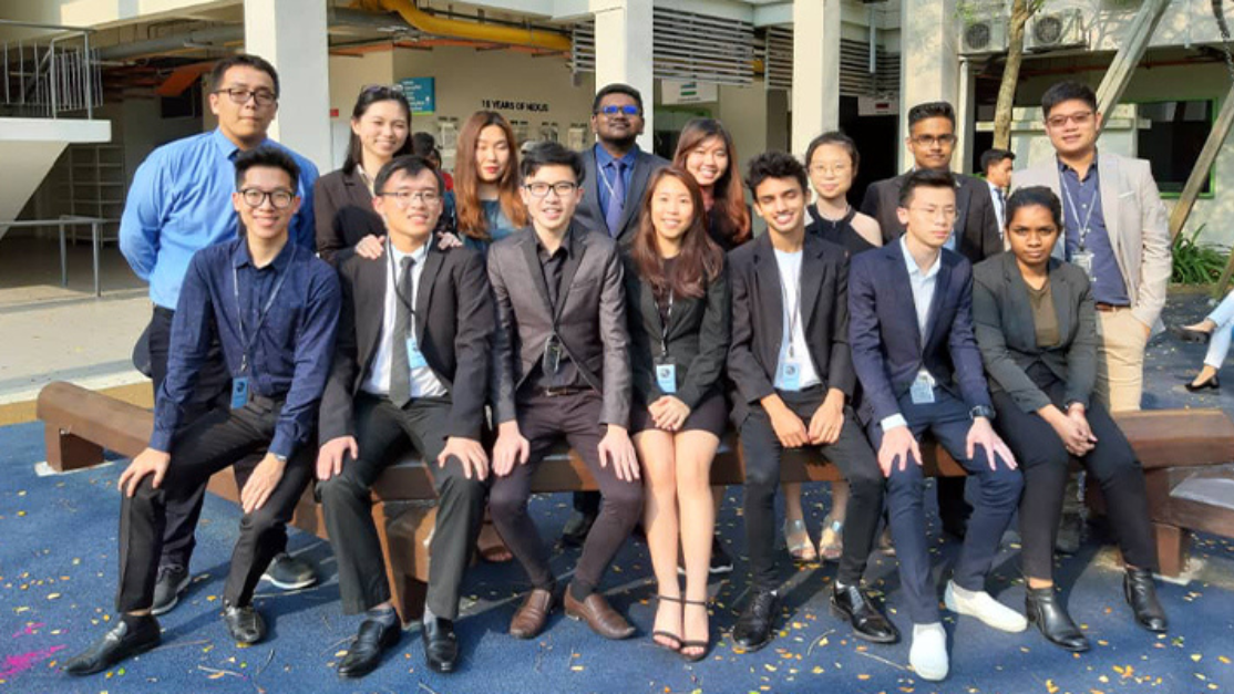 smartly dressed students in a photoshoot outside