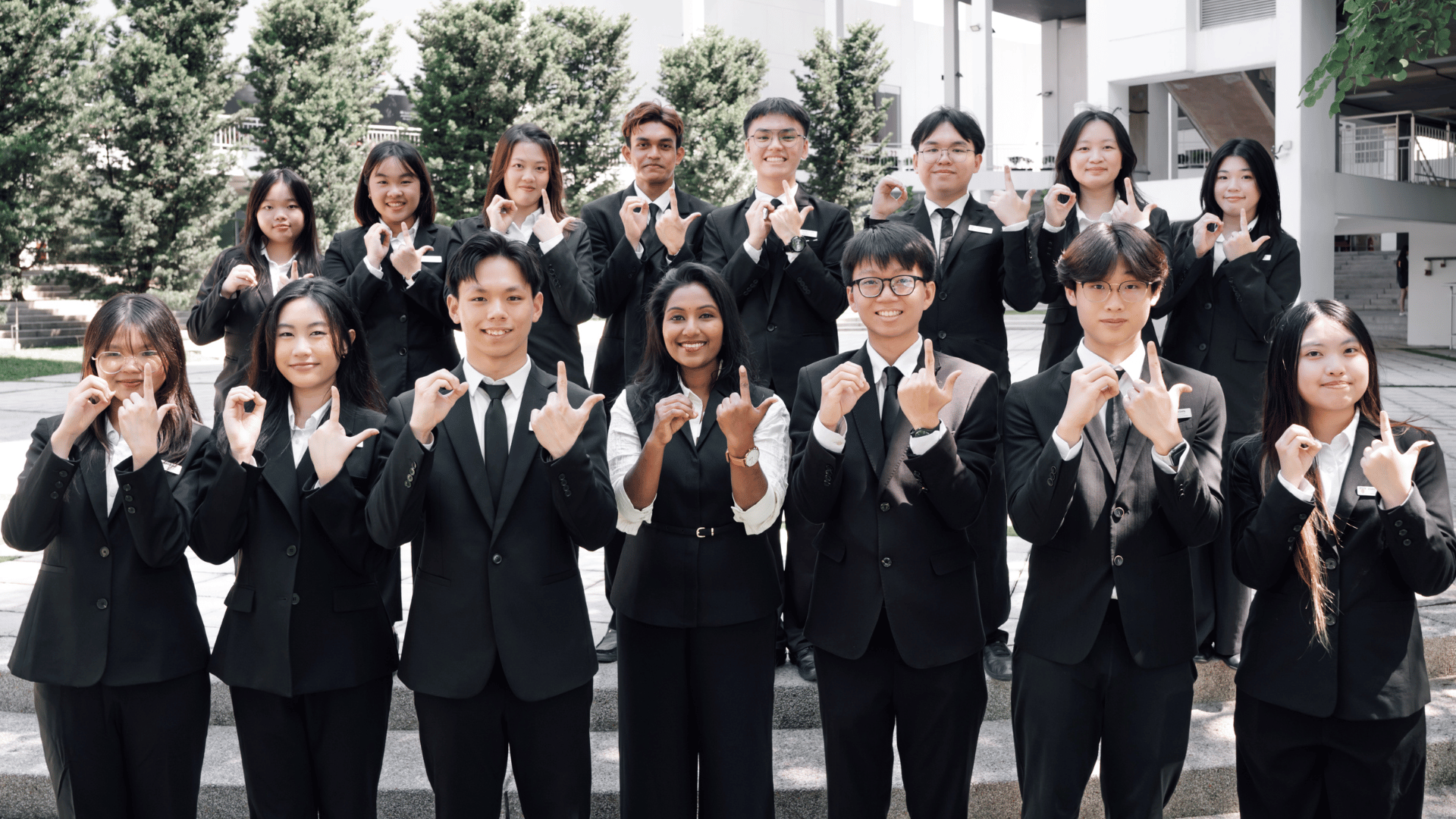 group picture of orientation leaders standing at the stairs