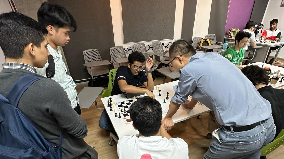 chess clubs students playing a game together