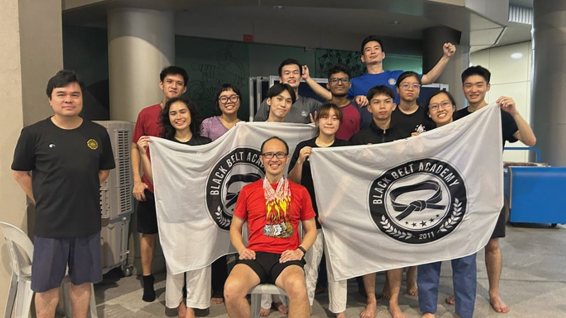 taekwondo club posing together